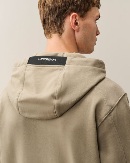 C.P. Company Diagonal Raised Fleece Lens Hoodie in Fallen Rock - Beige